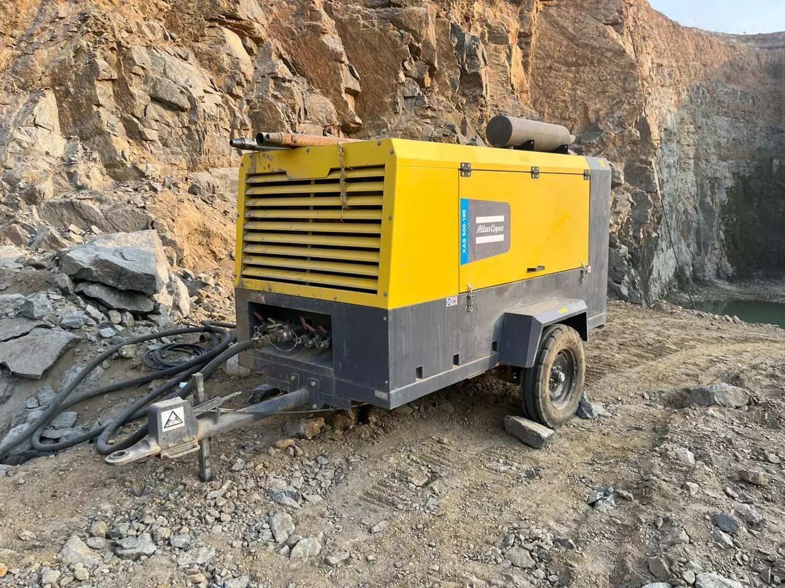 A mining air compressor supplies compressed air for pneumatic drills and other air-powered equipment.