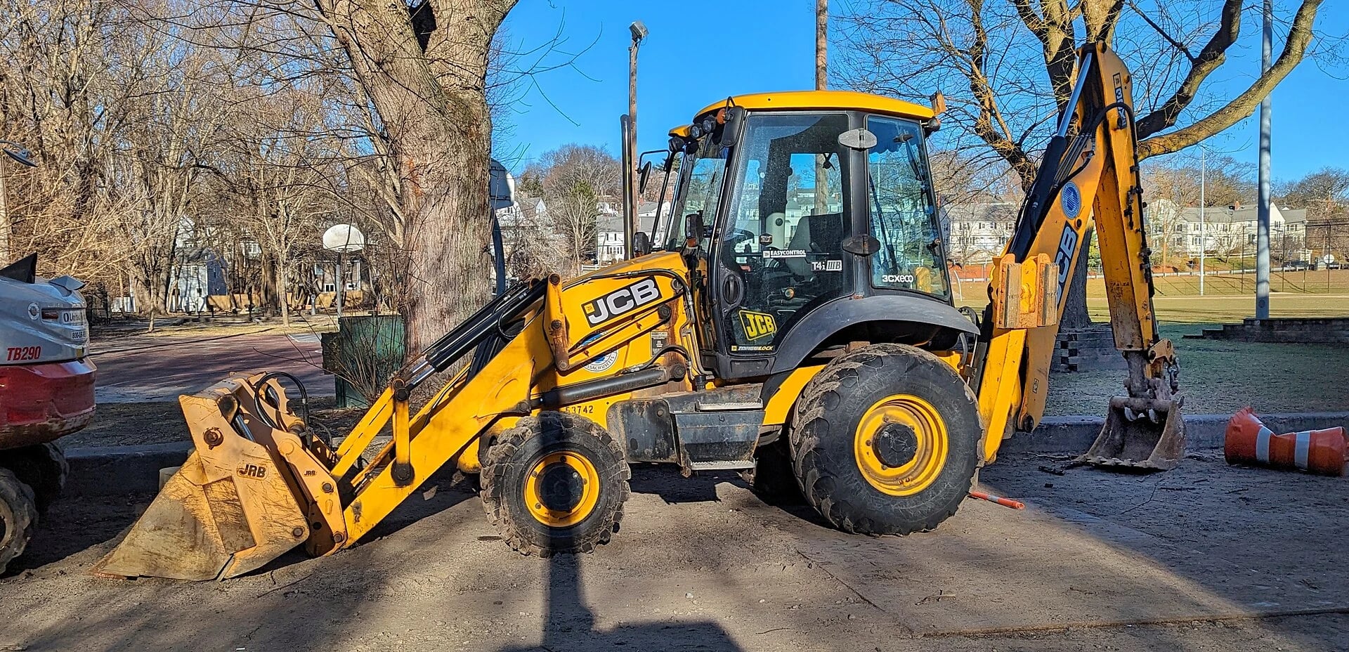 A backhoe loader combines a front loading bucket with a rear digging arm for trenching and site work.