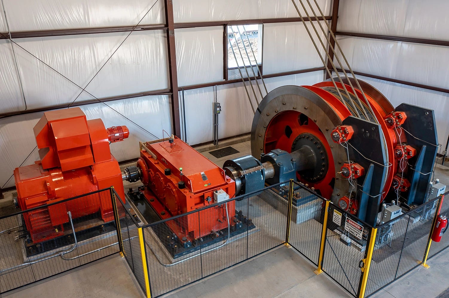A mine hoist and headframe guide and control the rope used to move loads through a shaft.